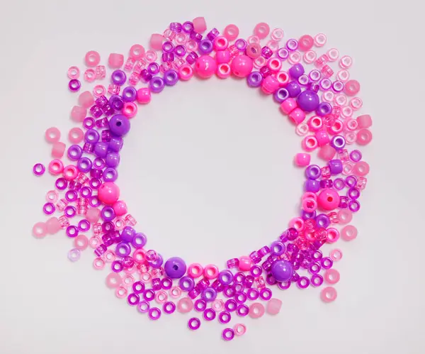 Pink Purple Plastic Beads Frame White Background Royalty Free Stock Photos