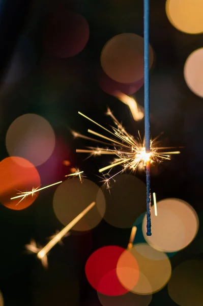 Christmas greeting card - White burning candle with natural decoration on rustic light wood - Merry Christmas and happy new year