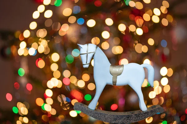 Christmas greeting card - White burning candle with natural decoration on rustic light wood - Merry Christmas and happy new year