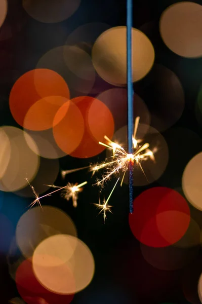 Christmas greeting card - White burning candle with natural decoration on rustic light wood - Merry Christmas and happy new year