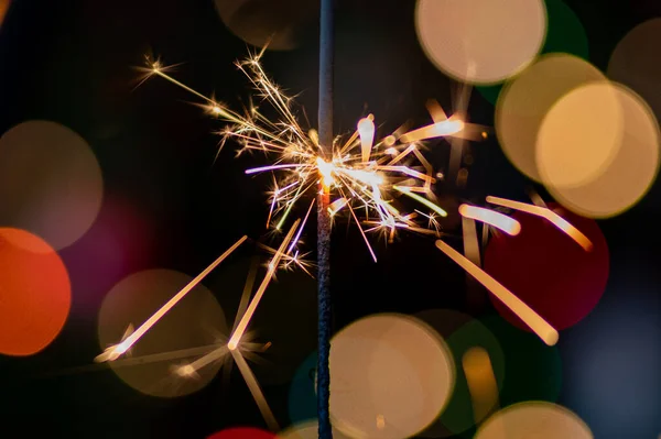 Christmas greeting card - White burning candle with natural decoration on rustic light wood - Merry Christmas and happy new year
