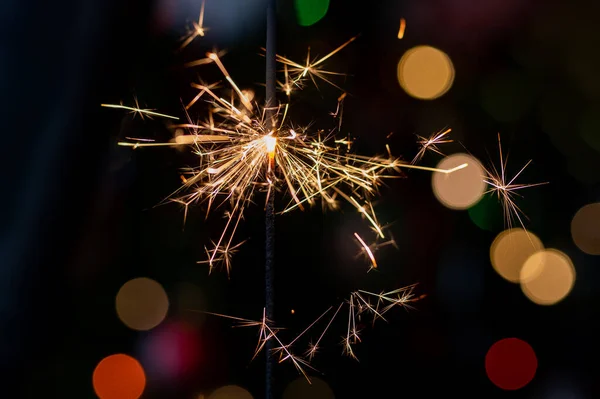 Christmas greeting card - White burning candle with natural decoration on rustic light wood - Merry Christmas and happy new year