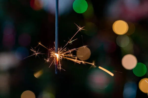 Christmas greeting card - White burning candle with natural decoration on rustic light wood - Merry Christmas and happy new year