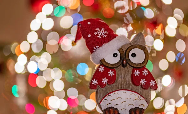 Christmas greeting card - White burning candle with natural decoration on rustic light wood - Merry Christmas and happy new year