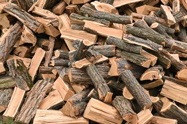 Lots of firewood. Fuel from renewable sources. background. selective focusing