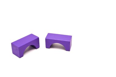 two wooden figures isolated in the form of an arch arm purple. constructor game for children. concept. text here