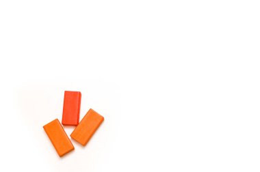 three wooden bricks isolated on a white background. a game for children. concept. mock up