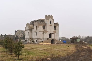a brick house without a roof. construction in progress. the concept of lack of funding and lack of money.