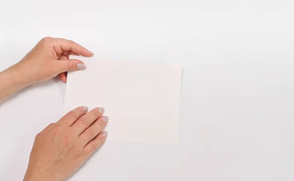 in the hands of a white sheet of paper in the hands of your advertising text