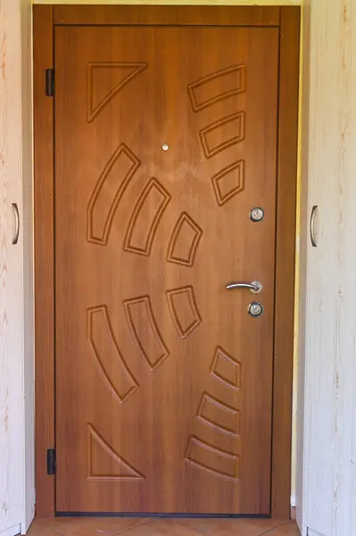 stylish brown armored front door inside. close-up