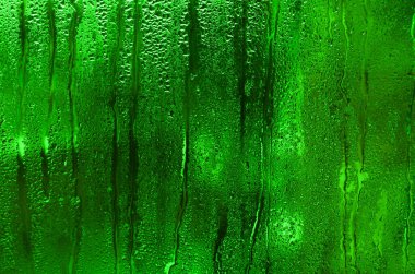 Çıkarıcı, soyut dokulu yeşil bir arkaplan..