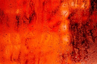 Kırmızı ıslak camın arkaplanı