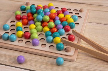 Children's educational wooden game. Montessori concept clipart