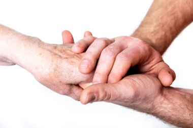 Beyaz arka planda soyutlanmış genç bir adam ve yaşlı bir kadının elleri. Büyükannesi oğluyla, torunuyla ya da hemşiresiyle. Nesillerin devamlılığı, aile değerleri, komşulara duyulan sevgi, yardım, bakım ve destek kavramı. 
