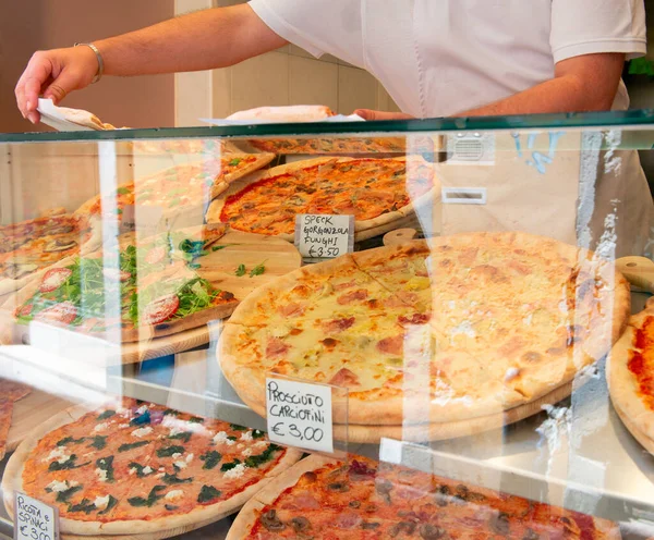 stock image Different types of pizza are sold in a street food cafe in Italy