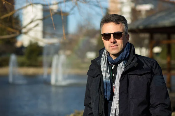 stock image Handsome mature man. Outdoor winter male portrait. Attractive confident middle-aged man in sunglasses.