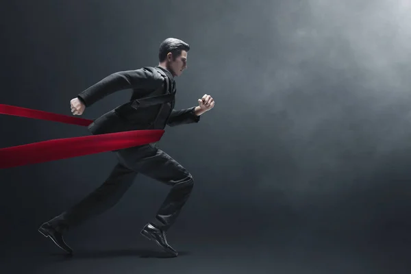 Business man running 3d illustration on dark background