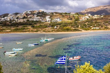 Scenic view of sea bay with boats and beach in background, in winter, in Anavyssos, Greece. Image taken from Agios Nikolaos Peninsula. clipart