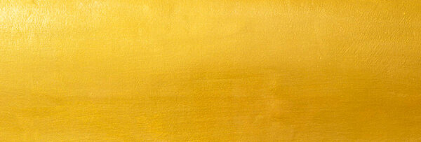 Gold texture background with yellow foil luxury shiny shine glitter sparkle of bright light reflection on golden surface, for celebration backdrop, wallpaper, Christmas decoration banner, horizonta