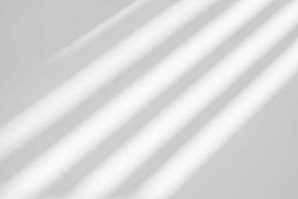Gray shadow and light blur abstract background on white wall  from window. Dark stripe grey shadows indoor in room  background, monochrome, shadow overlay effect for backdrop and mockup desig