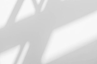 Gray shadow and light blur abstract background on white wall  from window. Dark stripe grey shadows indoor in room  background, monochrome, shadow overlay effect for backdrop and mockup desig