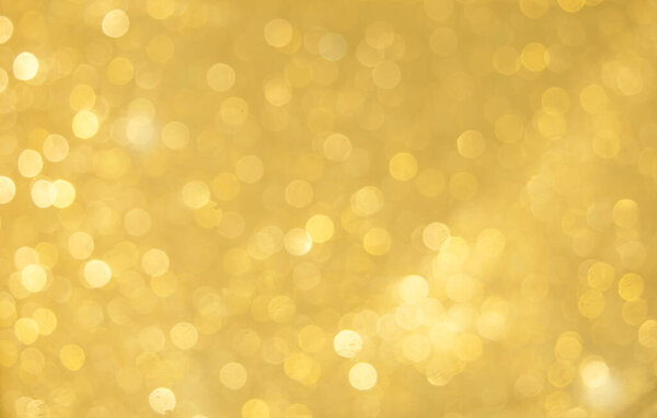 Gold bokeh background with luxury glitter golden bokeh light for background, wallpaper and web template design, blurred Christmas celebration ligh