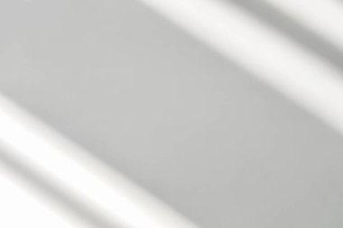Gray shadow and light blur abstract background on white wall  from window. Dark stripe grey shadows indoor in room  background, monochrome, shadow overlay effect for backdrop and mockup desig