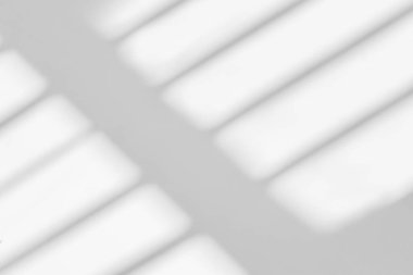 Gray shadow and light blur abstract background on white wall  from window. Dark stripe grey shadows indoor in room  background, monochrome, shadow overlay effect for backdrop and mockup desig