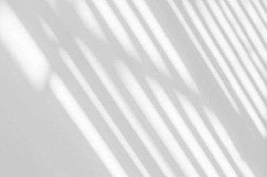 Abstract light reflection and grey shadow from window on white wall background. Gray stripe window shadows and sunshine diagonal geometric overlay effect for backdrop and mockup desig