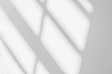 Gray shadow and light blur abstract background on white wall  from window. Dark stripe grey shadows indoor in room  background, monochrome, shadow overlay effect for backdrop and mockup desig