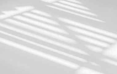 Gray shadow and light blur abstract background on white wall  from window. Dark stripe grey shadows indoor in room  background, monochrome, shadow overlay effect for backdrop and mockup desig