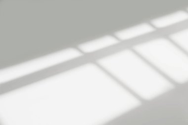 Gray shadow and light blur abstract background on white wall  from window. Dark stripe grey shadows indoor in room  background, monochrome, shadow overlay effect for backdrop and mockup desig