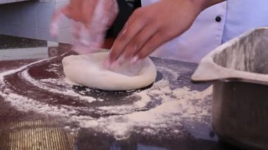 pizza making process working with dough