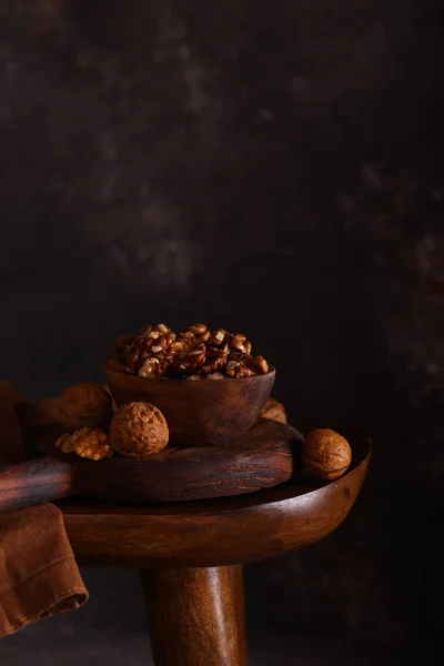 stock image peeled walnuts in a wooden bowl, rustic style