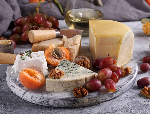 cheese board types of cheese Maasdam Roquefort Parmesan
