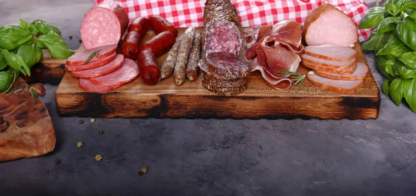 assorted deli meats ham, salami, prosciutto