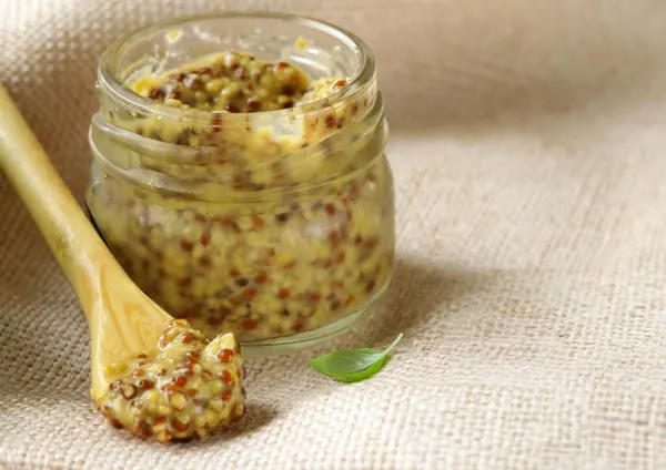 stock image traditional Dijon mustard condiment in a jar