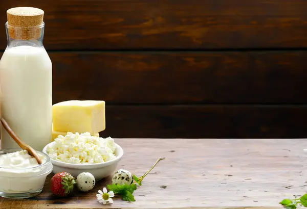 assortment of dairy products on a wooden table, rustic style