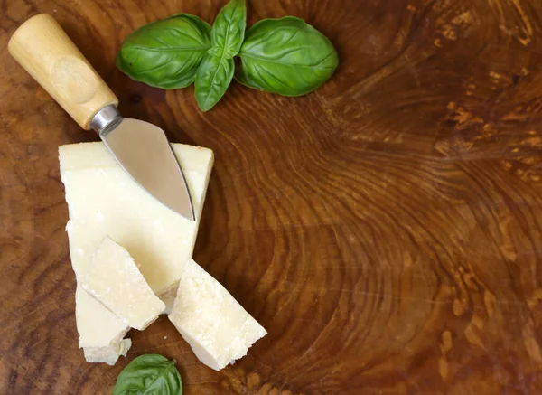 stock image hard parmesan cheese block on wooden table