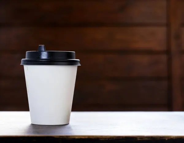 coffee to go in a paper cup