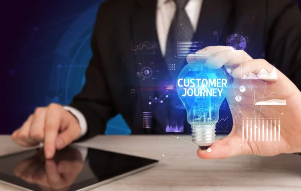 Businessman Holding Lightbulb Customer Journey Inscription Business Idea Concept — 图库照片