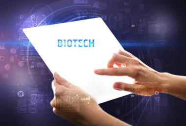 BIOTECH yazıtlı el işi fütüristik tablet, yeni teknoloji kavramı