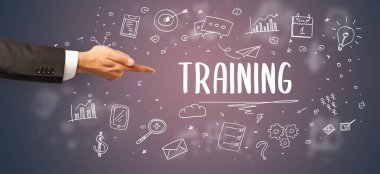 Kesilmiş ellerin yakın çekimi eğitim yazıtlarına işaret ediyor, modern iş çözümleri kavramı