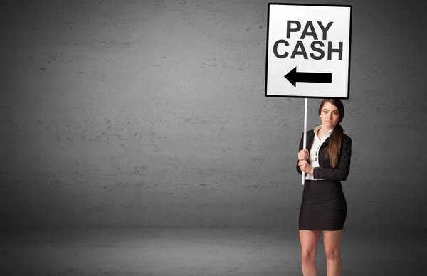 stock image business person holding a traffic sign with PAY CASH inscription, new idea concept