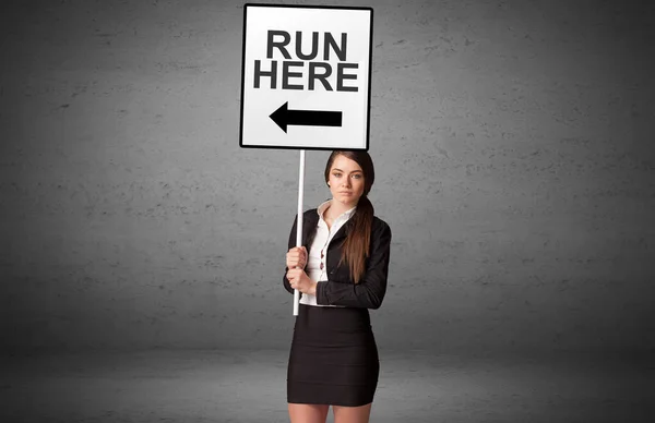 Бізнесмен Тримає Дорожній Знак Написом Run Here Нова Концепція — стокове фото