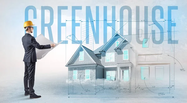 Jonge Ingenieur Houdt Blauwdruk Met Greenhouse Inscriptie Huis Planning Concept — Stockfoto