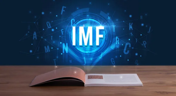 stock image IMF inscription coming out from an open book, digital technology concept
