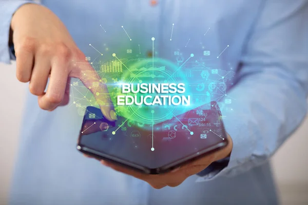 Affärsman Som Har Vikbar Smartphone Med Business Education Inskription Affärsidé — Stockfoto