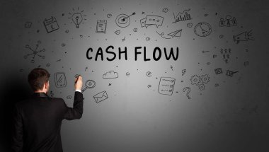 CASH FLOW yazıtları ve iş stratejisi konseptiyle yaratıcı bir fikir çizimi yapan işadamı.