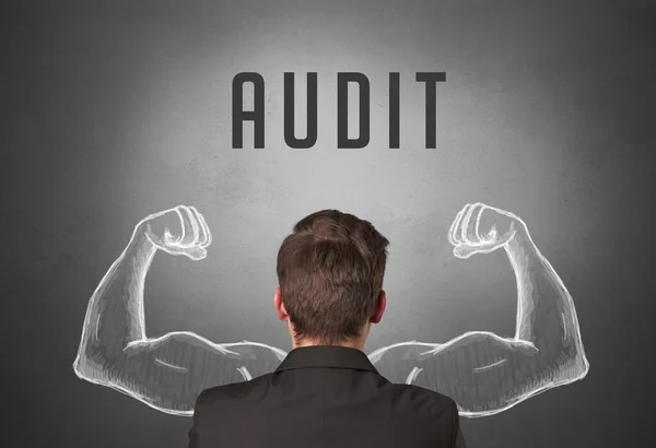 stock image Rear view of a businessman with AUDIT inscription, powerfull business concept